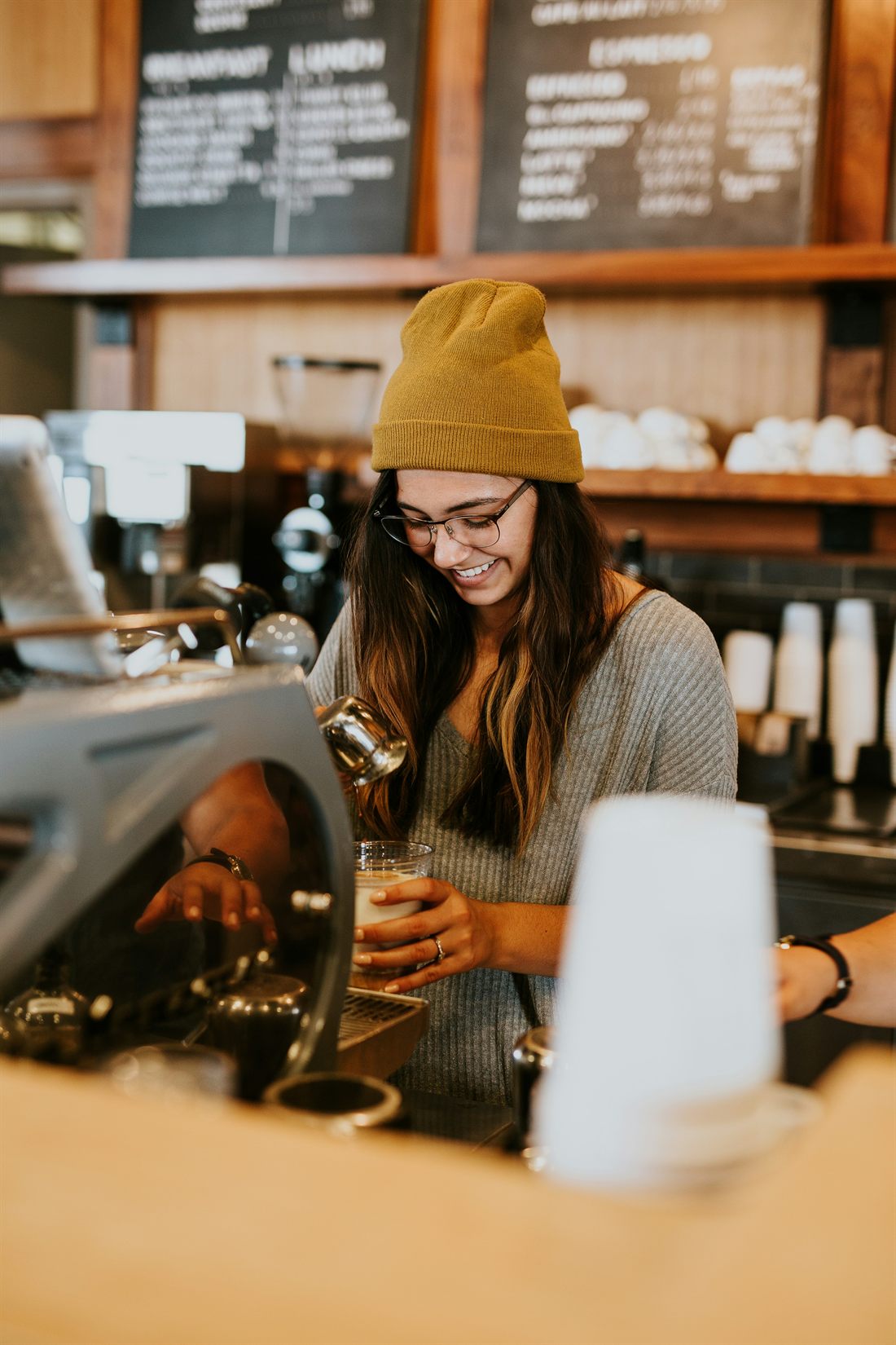 A small-business owner working at their counter